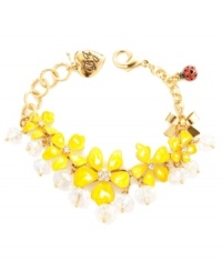 Warm up your look in hues inspired by the sun. Betsey Johnson's cheerful bracelet features bright yellow resin flowers with clear faceted beads and crystal accents. Set in gold-plated mixed metal with a red and black polka dot ladybug charm. Approximate length: 7-1/2 inches. Warm up your look in hues inspired by the sun. Betsey Johnson's cheerful bracelet features bright yellow resin flowers with clear faceted beads and crystal accents. Set in gold-plated mixed metal with a red and black polka dot ladybug charm. Approximate length: 7-1/2 inches.