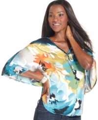 A vibrant floral print and alluring silhouette make Style&co.'s top gorgeous for day or night.