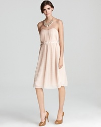 This ladylike French Connection dress is subtly seductive with a strapless neckline and low cut back. Wear it to an evening affair, or toss on a cardigan for a beautiful business lunch look. This ladylike French Connection dress is subtly seductive with a strapless neckline and low cut back. Wear it to an evening affair, or toss on a cardigan for a beautiful business lunch look.