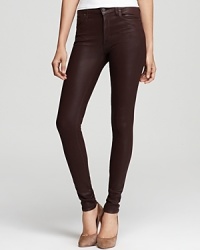 Coated with a leather-like finish, these skinny Citizens of Humanity jeans offer a luxe, satiny feel in a classic five-pocket silhouette. Coated with a leather-like finish, these skinny Citizens of Humanity jeans offer a luxe, satiny feel in a classic five-pocket silhouette.