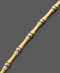 The simple, soothing lines of bamboo are replicated on this beautiful bracelet crafted in 14k gold and sterling silver over sterling silver. Approximate length: 7-1/2 inches. The simple, soothing lines of bamboo are replicated on this beautiful bracelet crafted in 14k gold and sterling silver over sterling silver. Approximate length: 7-1/2 inches.