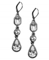 Line-up an elegant finishing touch. These Givenchy earrings feature crystal glass accents set in hematite-plated mixed metal. Approximate drop: 2-1/4 inches.