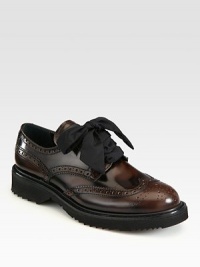 Spazzolato lace-up design with wingtip detail. Foam heel, 1¼ (30mm)Foam platform, ½ (15mm)Compares to a ¾ heel (20mm)Leather upperLeather liningRubber solePadded insoleMade in Italy Spazzolato lace-up design with wingtip detail. Foam heel, 1¼ (30mm)Foam platform, ½ (15mm)Compares to a ¾ heel (20mm)Leather upperLeather liningRubber solePadded insoleMade in Italy