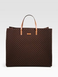 Dark brown Diamante embossed felt with cuir leather trim.Double handles, 5 dropEmbossed leather Gucci tagOpen topInterior metal D ringProtective metal feet18W X 15H X 7½DMade in Italy Dark brown Diamante embossed felt with cuir leather trim.Double handles, 5 dropEmbossed leather Gucci tagOpen topInterior metal D ringProtective metal feet18W X 15H X 7½DMade in Italy