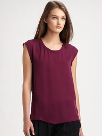 Chicer version of the cool-girl basic, this featherweight muscle tee is renewed by a pure silk silhouette that hits below the hips. RoundneckCap sleevesLonger length hits below the hipsSilkDry cleanImportedModel shown is 5'10 (177cm) wearing US size 2.