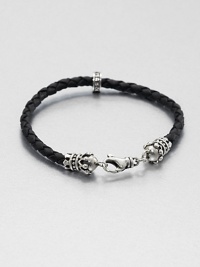 Thin braided leather bracelet is interrupted by a sterling silver crown for a refined, luxurious look, accented with a signature logo detail of sterling silver.Sterling silverLeatherAbout 9 longLobster claspMade in USA Thin braided leather bracelet is interrupted by a sterling silver crown for a refined, luxurious look, accented with a signature logo detail of sterling silver.Sterling silverLeatherAbout 9 longLobster claspMade in USA