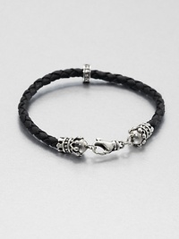 Thin braided leather bracelet is interrupted by a sterling silver crown for a refined, luxurious look, accented with a signature logo detail of sterling silver.Sterling silverLeatherAbout 9 longLobster claspMade in USA