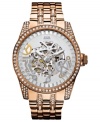 Cast a spell with the crystal shimmer on this reliable automatic watch from GUESS.