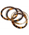 Sassy and stackable. This set of 9 bangle bracelets from GUESS feature fierce tortoise and shiny gold tone. Crafted in brown tortoise and gold tone mixed metal. Approximate diameter: 2-1/2 inches.