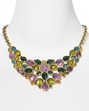 A statement making necklace crafted of luminous 12-karat gold plate, faceted gemstones in a dramatic color palette define this Carolee showpiece.