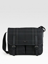 Leather trimmed nylon crossbody in iconic check print design.Flap, buckle closureAdjustable shoulder strapExterior, interior pockets95% nylon/5% acrylic15W X 12H X 3¼DMade in Italy Leather trimmed nylon crossbody in iconic check print design.Flap, buckle closureAdjustable shoulder strapExterior, interior pockets95% nylon/5% acrylic15W X 12H X 3¼DMade in Italy