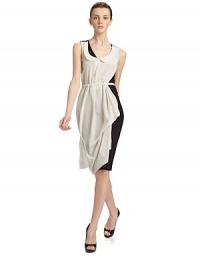 Chic avant-garde design features a contrast silk apron front layer over a jersey shift.Peter Pan collar Partial button front bodice Drawstring waist ties at the back Contrast jersey shift Back zipper About 42 from shoulder to hem Rayon Combo fabric: silk Dry clean Made in Italy Chic avant-garde design features a contrast silk apron front layer over a jersey shift.Peter Pan collar Partial button front bodice Drawstring waist ties at the back Contrast jersey shift Back zipper About 42 from shoulder to hem Rayon Combo fabric: silk Dry clean Made in Italy
