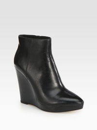 This powerful silhouette boasts sleek leather construction and a trendy point toe.Stacked wedge, 4½ (115mm)Stacked platform, 1 (25mm)Compares to a 3½ heel (90mm)Leather upperSide zipLeather lining and solePadded insoleImportedOUR FIT MODEL RECOMMENDS ordering true size. This powerful silhouette boasts sleek leather construction and a trendy point toe.Stacked wedge, 4½ (115mm)Stacked platform, 1 (25mm)Compares to a 3½ heel (90mm)Leather upperSide zipLeather lining and solePadded insoleImportedOUR FIT MODEL RECOMMENDS ordering true size.
