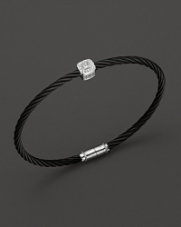 From the Celtic Noir Collection, a stackable bangle in white gold and and black PVD with diamond stations. Designed by Charriol. From the Celtic Noir Collection, a stackable bangle in white gold and and black PVD with diamond stations. Designed by Charriol.