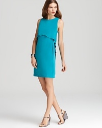 A softly ruffled overlay lends a feminine finish to this sleek Tibi dress in statement-hued silk. A softly ruffled overlay lends a feminine finish to this sleek Tibi dress in statement-hued silk.