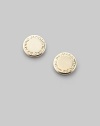 Polished disc-shaped studs, carved with the iconic designer's logo. Brass Diameter, about ¼ Post back Imported