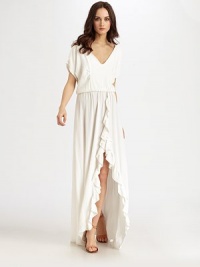 Fronted by cascading ruffles and a dramatic slit, this goddess-inspired design has a plunging v-neck, drop waist and short dolman sleeves. V-neckDropped shouldersShort dolman sleevesElasticized drop waistFront slitAbout 45 from natural waistRayonDry cleanImportedModel shown is 5'10 (177cm) wearing US size Small. Fronted by cascading ruffles and a dramatic slit, this goddess-inspired design has a plunging v-neck, drop waist and short dolman sleeves. V-neckDropped shouldersShort dolman sleevesElasticized drop waistFront slitAbout 45 from natural waistRayonDry cleanImportedModel shown is 5'10 (177cm) wearing US size Small.