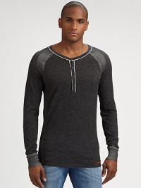 A classic henley sweater gets a contemporary feel in cozy, cotton accented by striped shoulder detail.CrewneckFour-button placketCottonMachine washImported