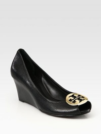 Pebbled leather essential with a goldtone designer medallion at the toe and rubber sole for traction. Stacked wedge, 2½ (65mm)Pebbled leather upperLeather liningRubber solePadded insoleImportedOUR FIT MODEL RECOMMENDS ordering one half size up as this style runs small. Pebbled leather essential with a goldtone designer medallion at the toe and rubber sole for traction. Stacked wedge, 2½ (65mm)Pebbled leather upperLeather liningRubber solePadded insoleImportedOUR FIT MODEL RECOMMENDS ordering one half size up as this style runs small.