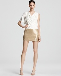 This Laundry by Shelli Segal dress features a gorgeously draped bodice punctuated by a sparkling sequin skirt. This Laundry by Shelli Segal dress features a gorgeously draped bodice punctuated by a sparkling sequin skirt.