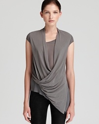 Bring sophistication to your t-shirt collection with this expertly draped Helmut Lang tee with asymmetrical hem. Bring sophistication to your t-shirt collection with this expertly draped Helmut Lang tee with asymmetrical hem.