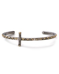 Gold-plated pyramid studs shine on this cool-girl cross cuff in gunmetal from House of Harlow 1960. Gold-plated pyramid studs shine on this cool-girl cross cuff in gunmetal from House of Harlow 1960.