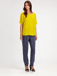 Soft cashmere, slightly oversized in a slouchy boatneck pullover.BoatneckDropped shouldersShort sleevesPullover styleAbout 26 from shoulder to hemCashmereDry cleanImportedModel shown is 5'10 (177cm) wearing US size Small.This style runs true to size. We recommend ordering your usual size for a standard fit. Soft cashmere, slightly oversized in a slouchy boatneck pullover.BoatneckDropped shouldersShort sleevesPullover styleAbout 26 from shoulder to hemCashmereDry cleanImportedModel shown is 5'10 (177cm) wearing US size Small.This style runs true to size. We recommend ordering your usual size for a standard fit.