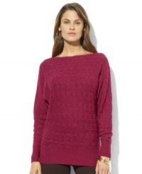 A unique horizontal cable knit and dolman sleeves lend modern appeal to Lauren Ralph Lauren's chic boatneck sweater. A unique horizontal cable knit and dolman sleeves lend modern appeal to Lauren Ralph Lauren's chic boatneck sweater.