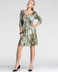 A soft, sophisticated Karen Kane Plus dress has shirred silhouette complete with an A-line skirt for a flattering, feminine style. A soft, sophisticated Karen Kane Plus dress has shirred silhouette complete with an A-line skirt for a flattering, feminine style.