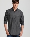 A handsome button-down from Elie Tahari modifies a military-inspired design for an innovative essential.
