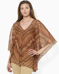 Embodying the rustic elegance of the Southwest in a serape-striped print, this airy georgette top speaks volumes in a beautifully draped silhouette. Embodying the rustic elegance of the Southwest in a serape-striped print, this airy georgette top speaks volumes in a beautifully draped silhouette.