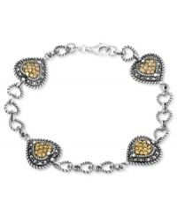 Hearts are in the right place on this bracelet from Genevieve & Grace. Crafted from sterling silver, the bracelet features marcasite and champagne crystal hearts for a lustrous touch. Approximate length: 7 inches. Approximate width: 1/2 inch. Hearts are in the right place on this bracelet from Genevieve & Grace. Crafted from sterling silver, the bracelet features marcasite and champagne crystal hearts for a lustrous touch. Approximate length: 7 inches. Approximate width: 1/2 inch.
