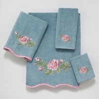 Luxurious velour towel is embellished with a large intricately embroidered rose in tones of pink and green. Finished with a scalloped edge trimmed in pink satin binding. Luxurious velour towel is embellished with a large intricately embroidered rose in tones of pink and green. Finished with a scalloped edge trimmed in pink satin binding.