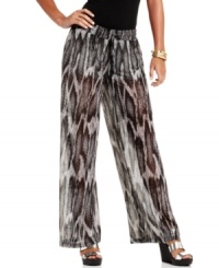 Slide into the fiercest pants of the season! GUESS? combines snakeskin print chiffon with a voluminous silhouette -- and creates a pair of palazzo pants that's illusion-style du jour! Slide into the fiercest pants of the season! GUESS? combines snakeskin print chiffon with a voluminous silhouette -- and creates a pair of palazzo pants that's illusion-style du jour!