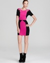 Vibrant colorblocking and cheeky cutouts make this hot-pink dress a hot choice when you go out this season.