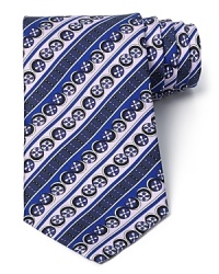 Flowers float in circles among ornate stripes and vibrant colors on this exciting silk tie from Emilio Pucci for a powerful contribution to your refined wardrobe. Flowers float in circles among ornate stripes and vibrant colors on this exciting silk tie from Emilio Pucci for a powerful contribution to your refined wardrobe.