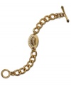 Make a name for yourself with this ID bracelet from Juicy Couture. Crafted from gold tone brass, zinc and stainless steel, the toggle bracelet features glass accents and cubic zirconia (1/2 ct. t.w.) for a hip effect. Approximate length: 6 inches.