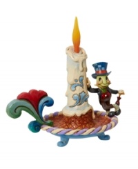 The lovable Disney character Jiminy Cricket leans against an ornately decorated candle. Jim Shore's take on the classic animated character detailed with festive touches makes it a great holiday gift. The lovable Disney character Jiminy Cricket leans against an ornately decorated candle. Jim Shore's take on the classic animated character detailed with festive touches makes it a great holiday gift.