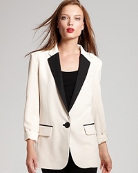 Top your looks with masculine edge with this Nanette Lepore tuxedo blazer, boasting classic detailing and a chic monochromatic palate. Top your looks with masculine edge with this Nanette Lepore tuxedo blazer, boasting classic detailing and a chic monochromatic palate.