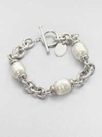 Three beautiful pearl stations on a rhodium-plated stainless steel chain link design. 12mm organic white baroque man-made pearlRhodium-plated stainless steelLength, about 7.5Toggle closureImported Three beautiful pearl stations on a rhodium-plated stainless steel chain link design. 12mm organic white baroque man-made pearlRhodium-plated stainless steelLength, about 7.5Toggle closureImported