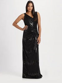 Shimmer in this sequin style featuring a v-neckline and a flattering side knot. V-neckSleevelessConcealed back zip closureSingle split back strapSide knotFully linedAbout 65 from shoulder to hem65% polyester/35% rayonDry cleanMade in USA of imported fabrics Shimmer in this sequin style featuring a v-neckline and a flattering side knot. V-neckSleevelessConcealed back zip closureSingle split back strapSide knotFully linedAbout 65 from shoulder to hem65% polyester/35% rayonDry cleanMade in USA of imported fabrics