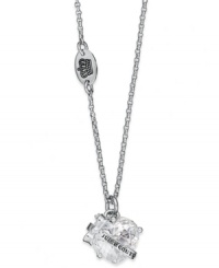 Statement-making sparkle. This Juicy Couture necklace features a faceted cubic zirconia (7-7/10 ct. t.w.) with a silver tone logo banner. Crafted in silver tone mixed metal. Approximate length: 15 inches + 3-inch extender. Approximate drop: 1/2 inch. Statement-making sparkle. This Juicy Couture necklace features a faceted cubic zirconia (7-7/10 ct. t.w.) with a silver tone logo banner. Crafted in silver tone mixed metal. Approximate length: 15 inches + 3-inch extender. Approximate drop: 1/2 inch.
