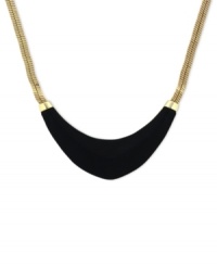 Blend rich elements for pure fashion. Vince Camuto's collar necklace highlights a black leather-wrapped half-moon pendant. Crafted in gold tone mixed metal. Approximate length: 18 inches. Blend rich elements for pure fashion. Vince Camuto's collar necklace highlights a black leather-wrapped half-moon pendant. Crafted in gold tone mixed metal. Approximate length: 18 inches.