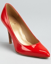 In slick patent leather, these Stuart Weitzman pumps breathe color into practicality. In slick patent leather, these Stuart Weitzman pumps breathe color into practicality.
