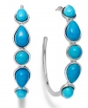Perfect hoops with a pop of color. Crafted in sterling silver, this summery style presents round and pear-cut turquoise (4-8 mm). Approximate diameter: 1-1/2 inches.