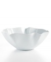 With its fluttering, flared edges, the Ruffle serving bowl adds a few soft curves to your contemporary Whiteware dinnerware collection from The Cellar.