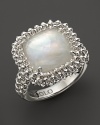 A bold sterling silver ring, gleaming with a rock crystal over Mother-of-pearl doublet, showcases Di MODOLO's unique Triadra cages.