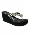 Animal prints and rhinestones and nameplates, oh my! Guess's Saturia wedge thong sandals have it all.