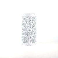Add a stylishly contemporary note to your table with this punched-metal hurricane that catches the light beautifully.
