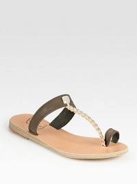 Embrace your inner goddess with this Grecian-inspired leather design, topped with a braided metallic leather t-strap and finished with a toe ring. Leather and metallic leather upperLeather lining and soleMade in GreeceOUR FIT MODEL RECOMMENDS ordering true whole size; ½ sizes should order the next whole size up. Embrace your inner goddess with this Grecian-inspired leather design, topped with a braided metallic leather t-strap and finished with a toe ring. Leather and metallic leather upperLeather lining and soleMade in GreeceOUR FIT MODEL RECOMMENDS ordering true whole size; ½ sizes should order the next whole size up.